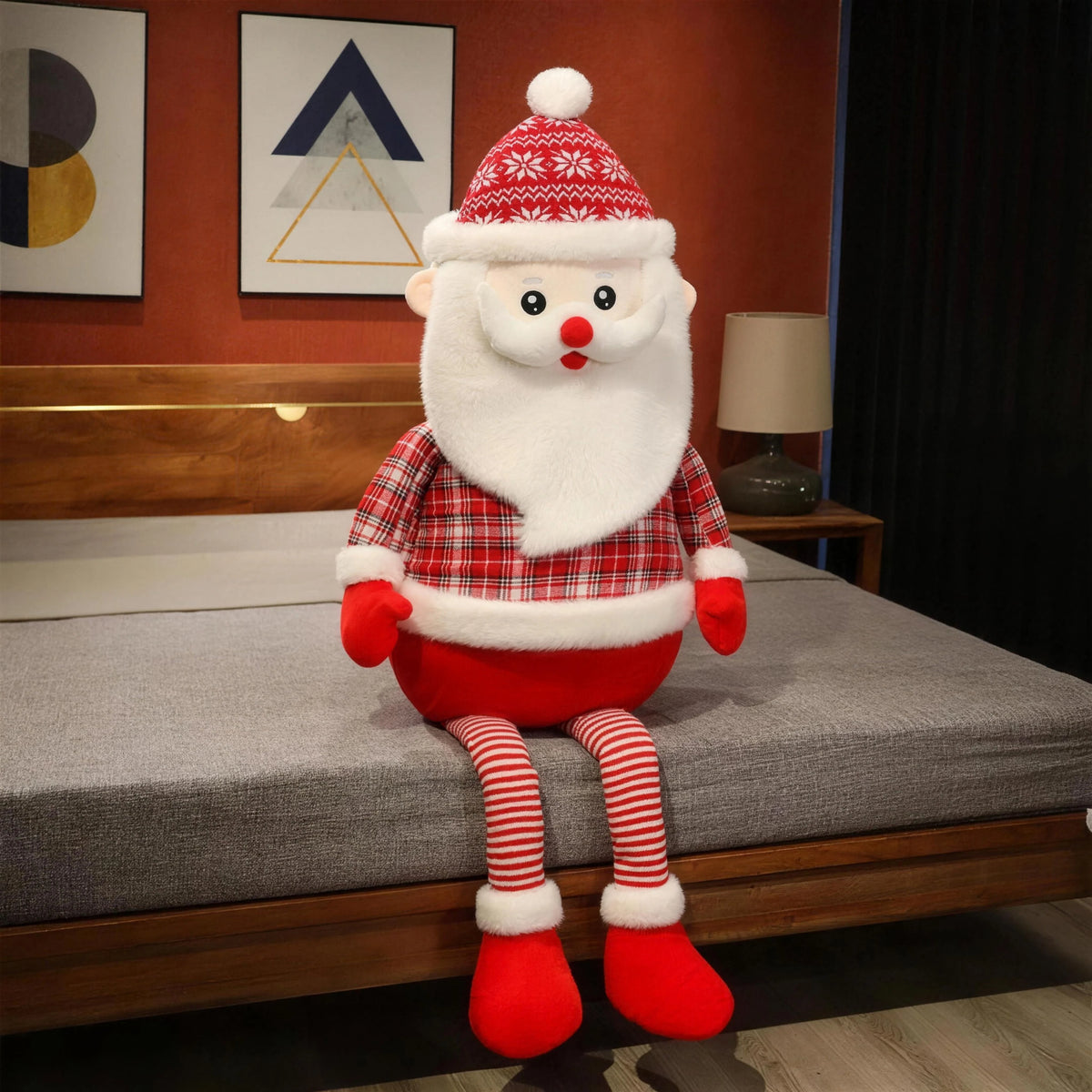 Cuddle Santa sitting on a bed